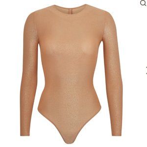 Skims Shimmer Long-sleeve Bodysuit in Nude